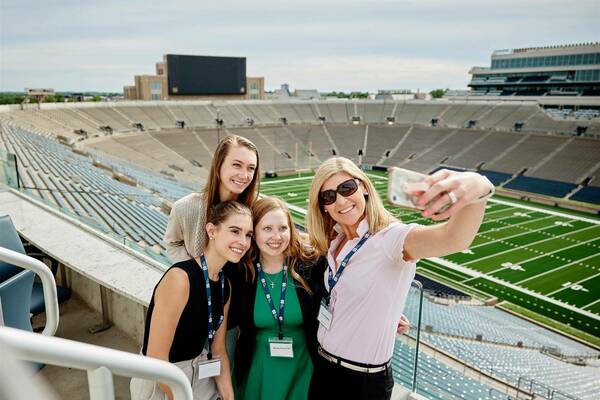 Group picture of Data Science students taking a selfie in the stadium.