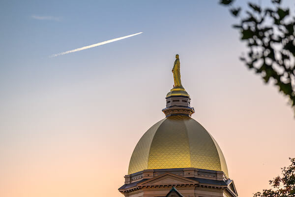 October 19, 2024; Golden Dome with jet contrail (Photo by Matt Cashore/University of Notre Dame)